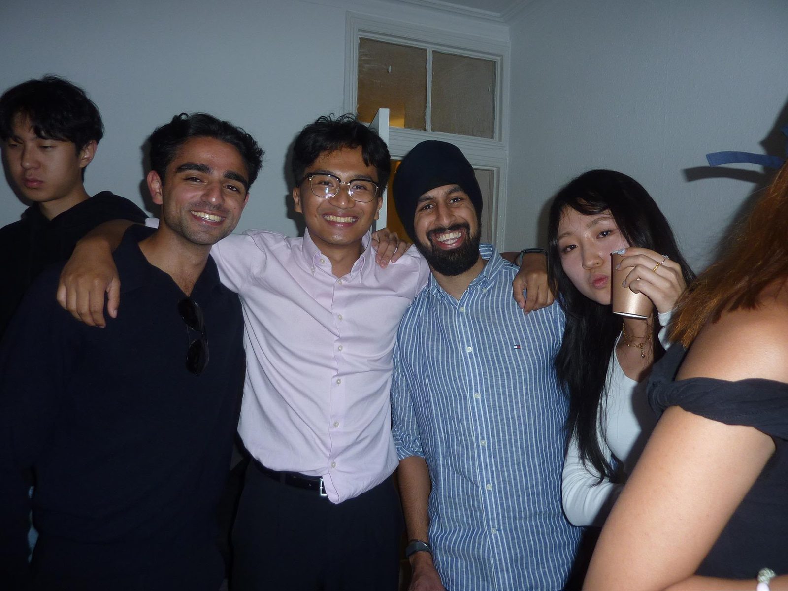 Nirmit with friends, arms around each other